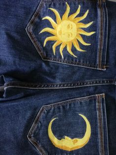 the sun and moon are painted on jeans