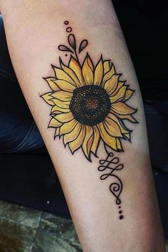 a sunflower tattoo on the arm