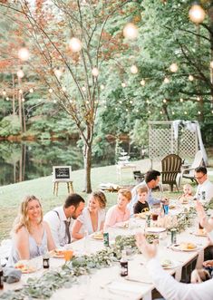 a group of people sitting around a table eating food