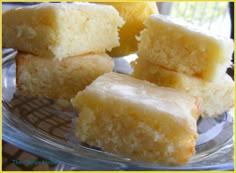 four pieces of cake sitting on top of a glass plate