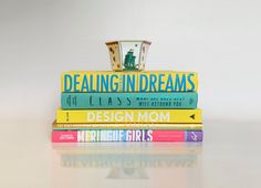 a stack of books that are stacked on top of each other with the title'dealing in dreams class mom '