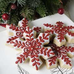 christmas cookies decorated with red and white icing