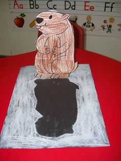 a child's drawing of a bear sitting on top of a table