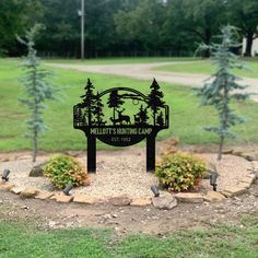 a metal sign that says meltitt's northing camp in front of some trees