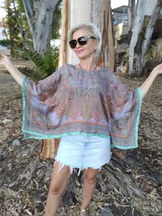 Silk poncho Fits size S/M Green Bohemian Tops For Fall, Multicolor Poncho For Beach Cover-up In Summer, Bohemian Multicolor Blouse For Fall, Oversized Batwing Sleeve Tops For Vacation, Multicolor Bohemian Blouse For Fall, Bohemian Multicolor Fall Blouse, Chic Festival Tunic Kaftan, Chic Tunic Kaftan For Festival, Casual Butterfly Sleeve Blouse For Vacation