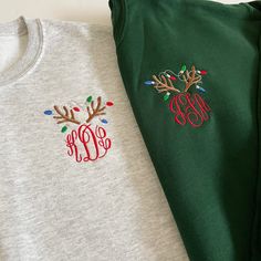 Our monogram reindeer sweatshirts are embroidered on our best selling crewneck sweatshirts. Choose your monogram font style. The design colors of the reindeer's antlers and lights will be as shown (light brown, light grey, red, kelly green, and royal blue) with a red monogram. PRODUCT DETAILS: Adult Unisex Sizes - 8 oz., pre-shrunk 50/50 cotton/polyester NuBlend® pill-resistant fleece High stitch density for a smooth printing canvas Seamless body with set-in sleeves 1x1 ribbed collar, cuffs and Monogram Clothes For Women, Monogram Ideas For Clothes, Christmas Monogram Ideas, Machine Embroidery Sweatshirt Ideas, Christmas Embroidered Sweatshirt, Monogram Sweatshirt Ideas, Christmas Embroidery Sweatshirts, Christmas Initials, Christmas Monogram Shirt