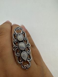 vintage rainbow moonstone ring  St is a silver finished bronze setting  May be marked 925 but is NOT.  This is one of my hand re finished treasures. Salvaged from vintage.  Size  9 Re sizing can be done for a $20 fee and may take up to a week.  Engraving is $4 per letter.  Thank you for supporting a veteran's small business. All jewelry is shipped free within the US in a stylish gift box Antique Oval Moonstone Ring, Bohemian Silver Moonstone Ring, Vintage Silver Crystal Ring With Natural Stones, Bohemian Moonstone Ring In Sterling Silver, Antique Moonstone Ring For Anniversary, Bohemian Silver Opal Open Ring, Bohemian Silver Open Opal Ring, Vintage Silver Moonstone Rings, Bohemian Silver Crystal Ring With Stone Setting