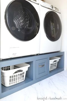 a washer and dryer sitting next to each other on top of a shelf