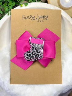 FREE SHIPPING for orders over $35! Add $35 worth of your favorite items to your cart and free shipping will automatically update. DETAILS You'll receive one hair bow as shown in the listing photo. Add a pop of color and style with this adorable 4" hair bow from Funky Loopy Love! Handmade with high-quality grosgrain ribbon, this bow features a fun and whimsical feltie bow center, making it the perfect accessory for any occasion. Attached to a sturdy alligator pinch clip, it's easy to wear and stays securely in place for all-day charm.  Sometimes it is difficult to know the exact color shades of an item from a photo. Please feel free to message me if you are unsure! SIZING  This item measures approximately 4" wide by 3" tall. The pinch clip on this bow is 2" long. MATERIALS Synthetic leather Cheetah Animal, Ribbon Hair Bows, Ribbon Hair, One Hair, Pink Leopard, Fuchsia Pink, Stylish Hair, Grosgrain Ribbon, Barrettes