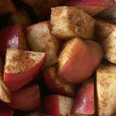 there is a bowl full of apples with cinnamon on top