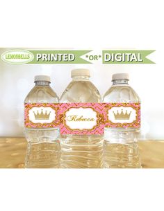 three bottled water bottles with labels on them