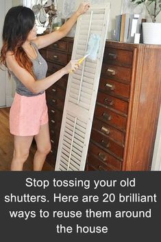 a woman cleaning an old shutters in her house