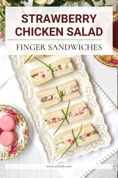 strawberry chicken salad finger sandwiches on a white platter with pink and green flowers in the background