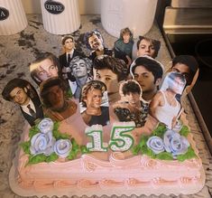 a birthday cake with the number fifteen on it and many pictures of people around it