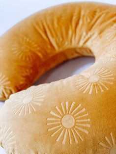 a close up of a donut shaped pillow