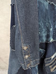 an old pair of jeans with holes in the back and side pockets that have been torn off