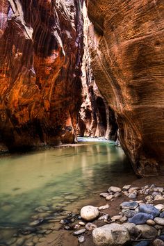 the water is running through the narrow canyon