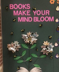 a door decorated with flowers and books to make your mind bloom in front of it