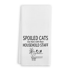 a white towel with the words spoiled cats live here with their household staff printed on it