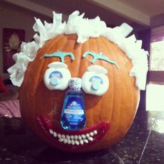 a carved pumpkin with an ad for mouthwash on it's face and eyes