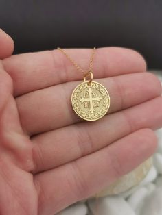 "Personalized 14k Solid Gold Dainty Cross Coin Necklace For Protection, Greek Orthodox Jewelry, ICXC NIKA Coin Pendant, Baptism Gift 0.65 Inch (16.5mm) Diameter pendant 14k Solid Gold ♥ Material of pendant and chain: Solid Gold 14K ♥ Packaging: All of our jewelry is beautifully boxed and ready for gifting For more personalized designs take a look here: ♥ www.etsy.com/listing/631444472 ♥ www.etsy.com/listing/645292671 ♥ www.etsy.com/listing/645282627 ♥ www.etsy.com/listing/631455364 ♥ www.etsy.co Gold Cross Jewelry For Blessing, Gold Cross Jewelry For Blessing Occasion, Gold Cross Pendant Jewelry For Blessing, Yellow Gold Coin Pendant Cross Jewelry, Yellow Gold Medallion Jewelry For Blessing, Hallmarked Yellow Gold Jewelry For Blessing, Yellow Gold Jewelry With Coin Cross Pendant, Engraved Cross Jewelry For Blessing, 14k Gold Engraved Jewelry For Blessing