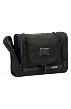 Featuring interior organization pockets and an antibacterial lining, this compact travel kit is designed to hang from towel racks or sit on flat surfaces. This travel essential is part of the Tumi Tracer program that helps locate missing or stolen bags. Style Name:Tumi Alpha 3 Hanging Travel Kit. Style Number: 5716490. Functional Foldable Travel Accessories For On-the-go, Portable Functional Travel Cases, Functional Portable Travel Cases, Black Portable Functional Travel Accessories, Foldable Functional Travel Accessories For On-the-go, Portable Functional Travel Accessories, Multifunctional Black Travel Accessories For Storage, Black Travel Accessories With Luggage Sleeve For Organization, Functional Black Cases For Organization