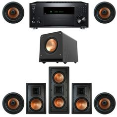 an array of speakers, subwoofers and amps are arranged in front of each other