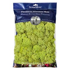 a bag of broccoli florets sitting on top of a white table