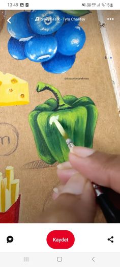 someone is drawing some food with colored pencils