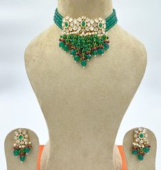 Gold Finish Bright Turquoise Green and Dark Red Beads Kundan Choker Set with Pearls, Mona Lisa Beads, and Stones Festive Green Beaded Kundan Necklace, Green Beaded Bridal Necklace With Round Beads, Green Kundan Necklace With Round Gemstone Beads, Green Kundan Necklace With Faceted Beads As Gift, Traditional Green Beaded Bridal Necklace, Polished Green Beads For Festivals, Green Beaded Necklace With Stone Work For Gift, Green Beaded Necklace With Stone Work As Gift, Green Faceted Beads Necklace For Festivals