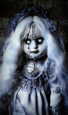 a creepy doll with white hair and makeup