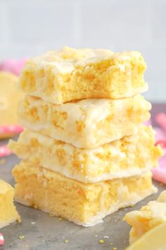 a stack of lemon bars sitting on top of a table