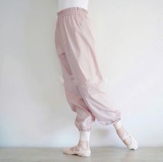 This dreamy, soft, true baby pink trash bag pants are my favorite of all. Soft coated material makes little to no noise that warms you up by plié . size measurements： xs: 24.4"~37.8" at waist 41" at hip 39" long s: 26"~39.4" at waist 41.8" at hip 40.6" long Trash Bag Pants, Ballet Pants, Ballet Fits, Bag Pants, Womens Sports, Leotards Ballet, Trash Bag, Leotards, Sports Women