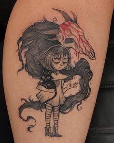 a girl with a demon head on her thigh holding onto a woman's arm