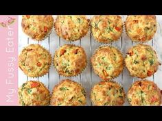 several muffins are cooling on a rack with some toppings in the middle