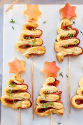 several appetizers are arranged in the shape of a christmas tree