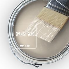 a paint can with a brush in it and labeled natural twine on the side