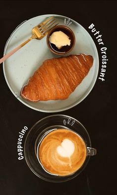 there is a croissant and cup of coffee on the plate next to each other