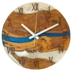 a clock made out of wood with blue hands