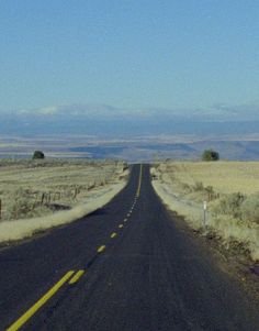 an empty road in the middle of nowhere