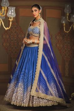 Electric blue toned attached cancan cotton simmer chanderi crinkled lehenga with wave style chevron gota embroidery and heavy tassel ornamentations. Paired with a noodle strap flattering sweetheart neckline padded blouse with geometric gota jaal embroidery, dori embroidered hem detail and heavily embellished scallop border net dupatta with gold toned placement stripe details. - Aza Fashions Jaal Embroidery, Embroidered Bridal Lehenga, Gota Embroidery, Noodle Strap, Lehenga Pattern, Scallop Border, Embroidered Hem, Padded Blouse, Lehenga Blouse