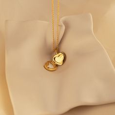 Our Mother of Pearl Heart Locket combines both sentimentality and elegance. Insert any picture that is close to your heart in the dainty locket charm and allow that image to bring you peace whenever you need it. The delicate chain and pendant are perfect for layering with your other meaningful pieces to create a nostalgic jewelry look. SKU: RR-NR171 Product Details Material: High Quality Solid 925 Sterling Silver Finish: Sterling Silver ∙ 18K Gold Locket comes without a photo. Photo insertion se Elegant Heart Locket Charm Necklace, Elegant Heart Shaped Locket Charm Necklace, Elegant Heart-shaped Locket Charm Necklace, Elegant Heart Locket Necklace With Adjustable Chain, Elegant Charms Locket Necklace For Mother's Day, Double Heart Locket Charm Necklace For Keepsake, Dainty Double Heart Locket Necklace, Wedding Heart Pendant Locket Necklace With Charms, Keepsake Double Heart Locket Charm Necklace