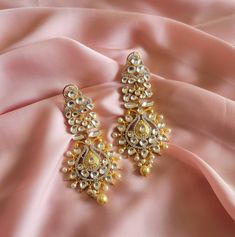 gold long earring gold plating Bollywood  Indian  long earring Pakistani jewelry Plated in high  quality  gold plating are beautiful, elegant & will surely galvanize you, because our products are unique, comfortable, fashion forward & very popular for the rich look.  *High quality craftsmanship 100% satisfaction guarantee  *Plated in Gold plating *Earring Closure push back *base metal for earring in brass * Earring length 9.5cm *width 4.5cm *package include pink gold earrings  *ready to ship from Houston TX United States GIFT- It comes in gift box perfect for gifting to your mom , sister, in laws, friends, on there birthday, wedding , bridal shower, anniversary, festival , and many more... Discover a variety of Necklace sets and Earring  only at Azzashiny.fj . our product are made from met Bollywood Gold Danglers With Stone Work, Gold Bollywood Danglers With Stone Work, Heavy Gold Bollywood Danglers, Festive Gold Danglers With Stone Work, Gold Bollywood Bridal Earrings For Diwali, Gold Chandelier Drop Earrings With Stone Work, Bollywood Gold Chandbali Danglers, Gold Drop Earrings With Stone Work, Bollywood Style Gold Plated Chandelier Earrings