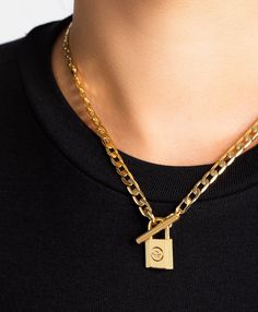 Keep your loves or your lusts under lock and key with the Harpa necklace. Crafted in 18ct gold plate it features a chunky curb chain finished with a subtly engraved gold lock. This statement piece adds a touch of decadence to your everyday style. Material: 18ct Gold Plated Brass. Dimensions: 42cm Gold Chain Link Necklace With Lock, Gold Chain Necklace With Lock For Gift, Under Lock And Key, British Heritage, Swedish Design, Lock And Key, Branded Gifts, Watches Jewelry, Curb Chain