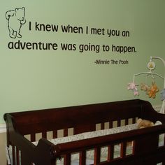 a baby's room with a crib and wall decal that says, i knew when i met you an adventure was going to happen