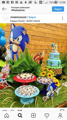 a table filled with lots of food and balloons