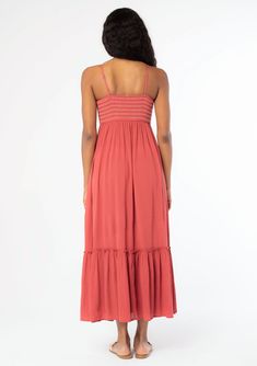 A timeless bohemian maxi dress you'll be reaching for all season. Designed in a flowy crinkle gauze, this effortless dress features a slim-fit smocked bodice with contrast thread detail, adjustable spaghetti straps, and must-have side pockets. Crinkle gauze Slim fit smocked bust Flowy skirt Sleeveless Maxi length Ruffle-trimmed tiered skirt Straight neckline Contrast thread detail Button front Adjustable spaghetti straps Side pockets Flowy bohemian maxi dress Model is 5'9, wearing a size S.Style Maxi Length Dresses With Smocked Back And Flowy Skirt, Breezy Flowy Midi Length Sundress, Breezy Flowy Midi Sundress, Brunch Maxi Dress With Smocked Back And Flowy Skirt, Flowy Rayon Midi Sundress, Flowy Ruched Sundress Midi Length, Flowy Breezy Rayon Midi Dress, Flowy Midi Dress With Smocked Bodice, Bohemian Empire Waist Maxi Dress For Beach