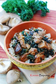 an orange bowl filled with rice and mushrooms