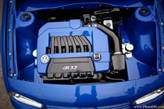 the engine compartment of a blue sports car