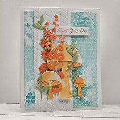 a card with mushrooms and flowers on it